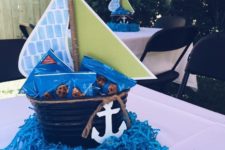 02 a nautical centerpiece of a bucket with crackers and an anchor