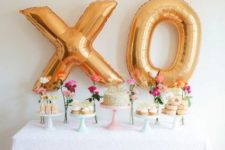 02 gold letter XO balloons as a dessert table backdrop