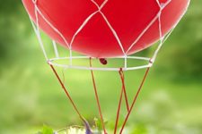 03 a bold red hot air balloon centerpiece with florals
