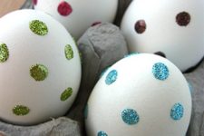 03 stick clear adhesive dots onto eggs and dip in sprinkles or glitter for easy decorating