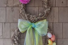 04 a spring Easter wreath with faux eggs and a bow