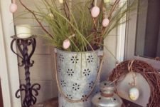 07 a perforated bucket with branches and grass, egg ornaments