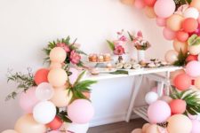 09 blush, peach and pink balloon garlands with palm leaves for a tropical celebration