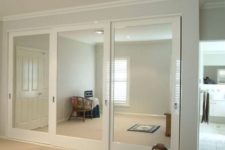 09 whole wall of sliding mirror closet doors visually doubles the space