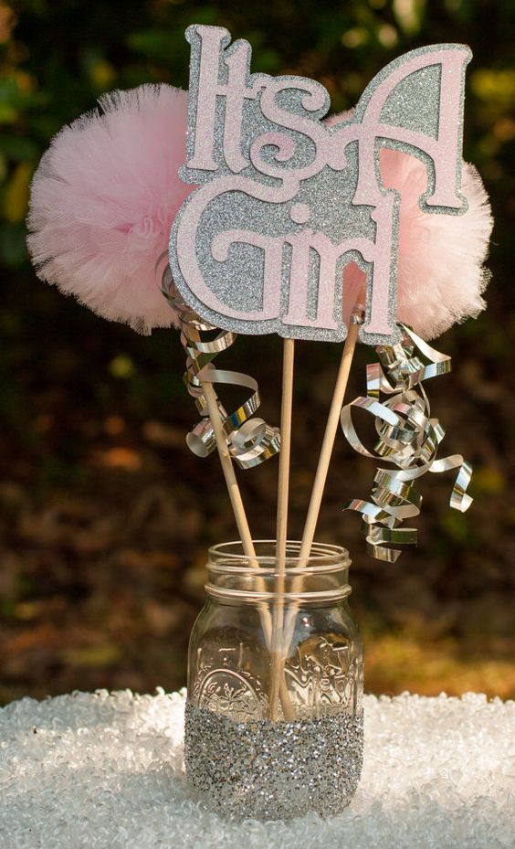 a glitter mason jar with letter props and pompoms