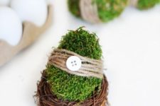 10 moss covered Easter eggs with twine, buttons and in nests