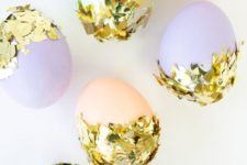 10 pastel eggs decorated with gold foil in a messy way