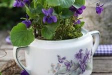 10 violas ina  vintage sugar bowl with violas painted on it
