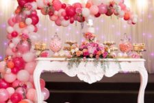 12 pink, blush and white balloon arch over the dessert table