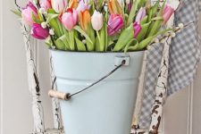 14 a bucket with colorful tulips will scream spring