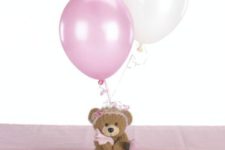 14 a teddy bear with pink balloons for a girl’s baby shower