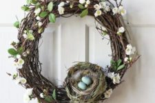 14 grapevine spring wreath with faux flowers and leaves, a nest with feathers and eggs