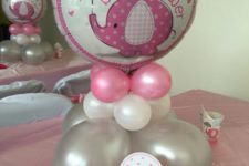 16 grey, white and pink balloons with a giant elephant one