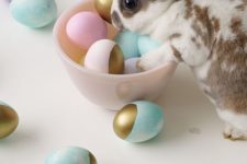 16 marble Easter eggs dipped in gold paint