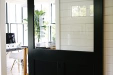 16 oversized black barn door with a glass top makes a statement