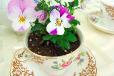 17 a vintage tea cup and a saucer with bold violas