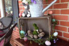 17 bold spring flowers in a watering can and egg arrangements