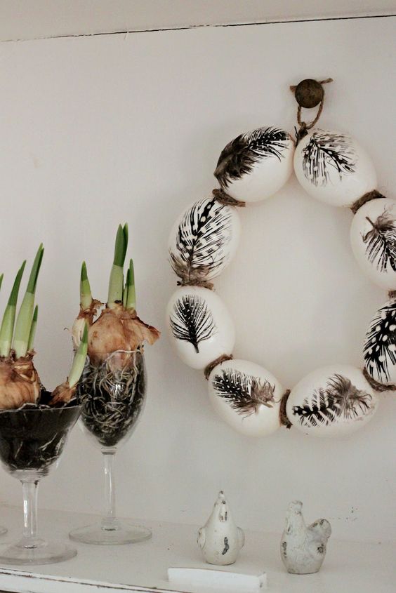 bulbs in glasses and a feather egg Easter wreath