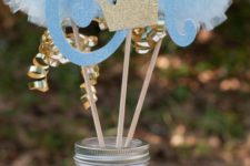 18 glitter mason jar with paper pompoms and glitter crowns for a prince-themed party