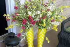 18 upcycled rainboots as a vase for spring blooms