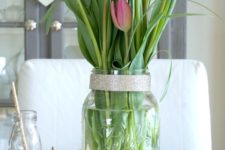 19 modern elegant centerpiece of a jar with tulips and grasss