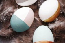 19 partly painted Easter eggs in pastel and metallic shades