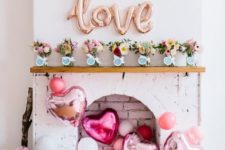 20 lots of pink balloons and LOVE letters over the faux fireplace