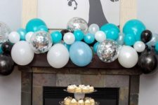 20 turquoise, white and black balloon fireplace decor for a themed party