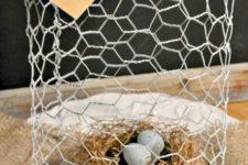 21 a wire cloche with a bird’s nest and little eggs