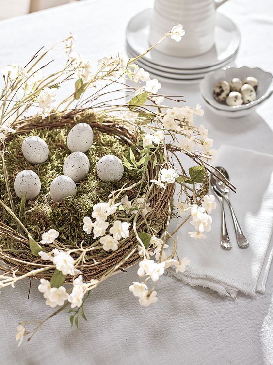 a beautiful Easter centerpiece of a nest with moss, cherry blossom and eggs is a lovely idea