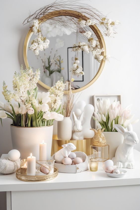 a pretty modern Easter console in neutrals with eggs, bunnies, fresh white blooms and candles is adorable