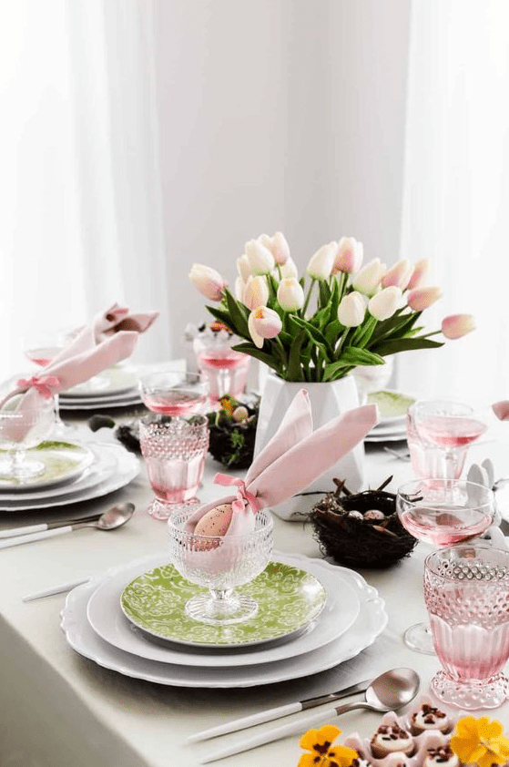 a simple and cool Easter or spring centerpiece of a faceted vase with blush tulips is a cool and catchy idea