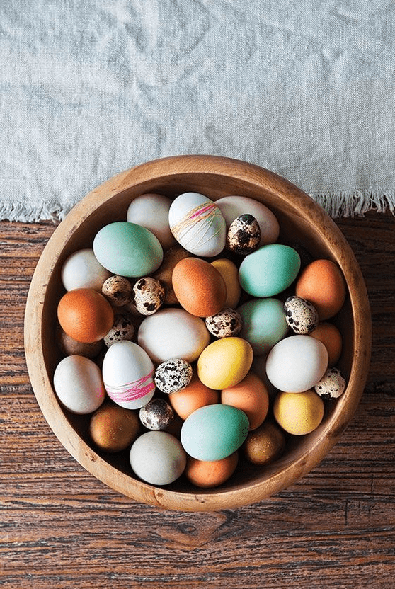 colorful, speckled and yarn decorated Easter eggs are a very nice and bold idea for Easter