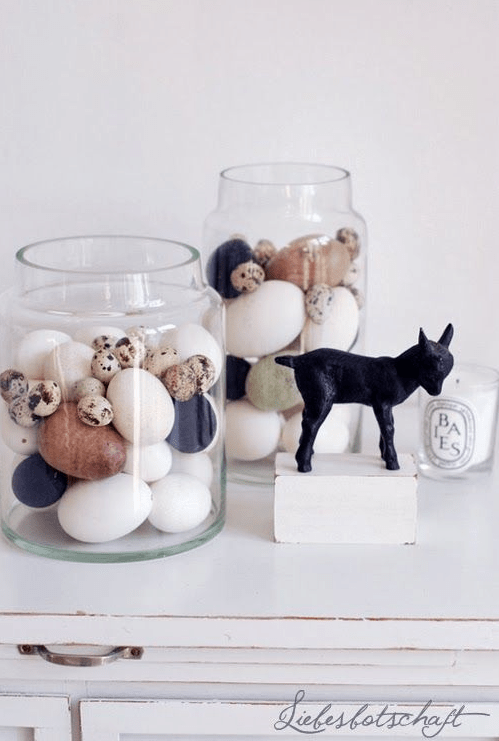 jars with modern Easter eggs don in black, white, amber, green and with speckles are amazing for a modern space