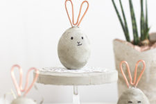 DIY concrete egg-shaped Easter bunnies with copper wire ears
