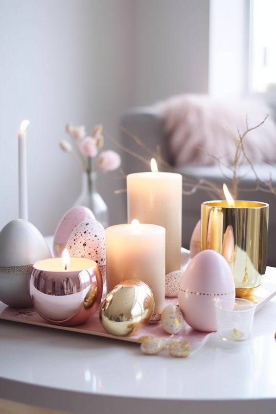 modern glam Easter decor with a tray, blush metallic and gold candleholders and beautiful pastel eggs plus candles around