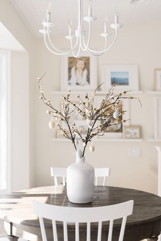 real blooming branches with pastel fake eggs are a cool spring or Easter decoration you can make