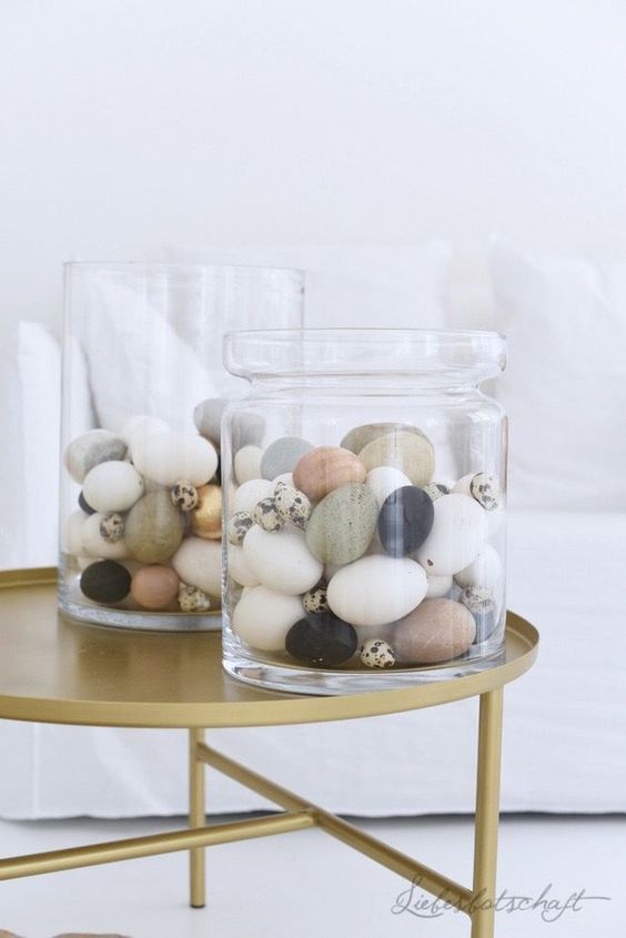 stylish modern Easter decor with oversized jars and pastel and neutral eggs is very easy to repeat