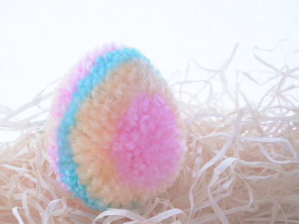 DIY colorful and patterned pompom Easter eggs (via www.molliemakes.com)