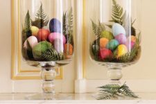 02 glass hurricanes with fern leaves and colorful eggs is a creative idea