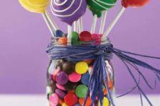 05 a jar with colorful M&Ms and cake pops to top