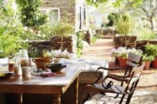09 a rustic vintage table and antique forged chairs will be a perfect solution for a French country dining space