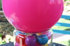 10 a colorful ball centerpiece in a jar and a pink balloon on top