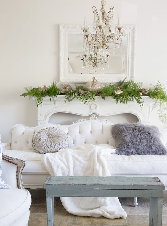 a refined white sofa looks cool with a shabby chic blue bench