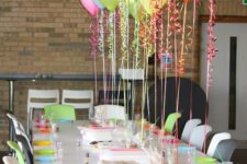 13 attach colorful balloons to the table to create floating decor