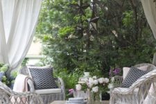 13 fresh and inviting patio design with white wicker furniture and a vintage coffee table