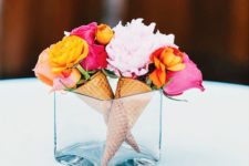 14 a vase with real ice cream cones and blooms inside
