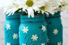 14 blue mason jars with painted camellias and with fresh blooms, too