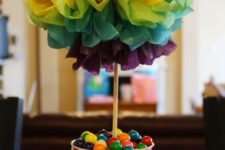 15 a small bucket with colorful candies and a colored paper topiary