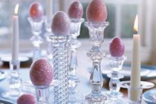 16 glittered Easter eggs on glass candlesticks make for an elegant table display